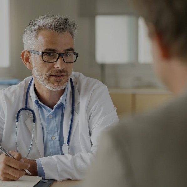 A doctor speaking with a patient