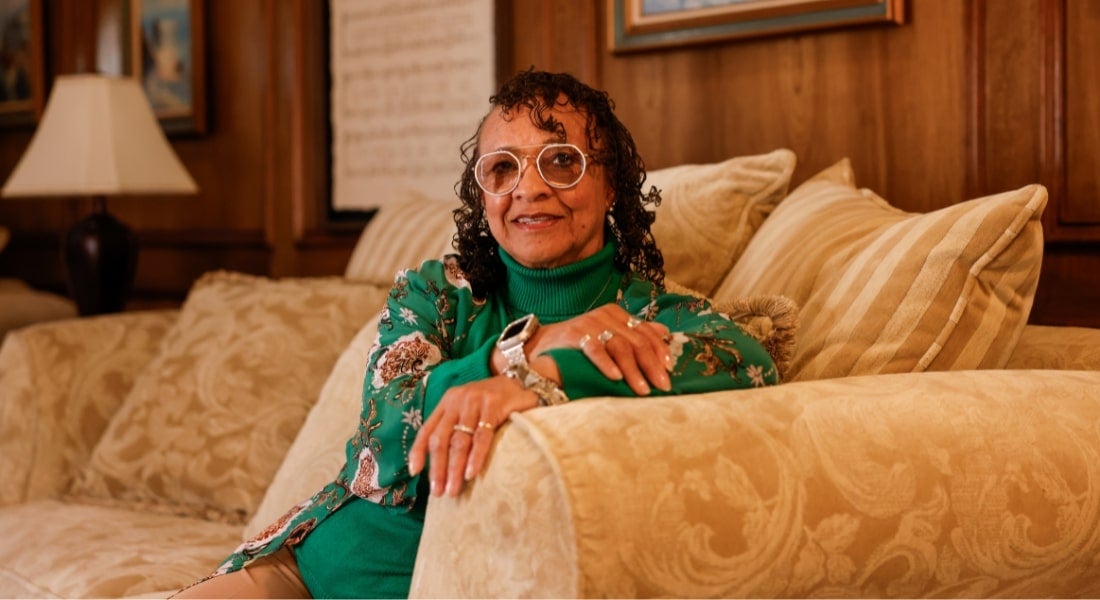 Deborah Williams sitting on a couch