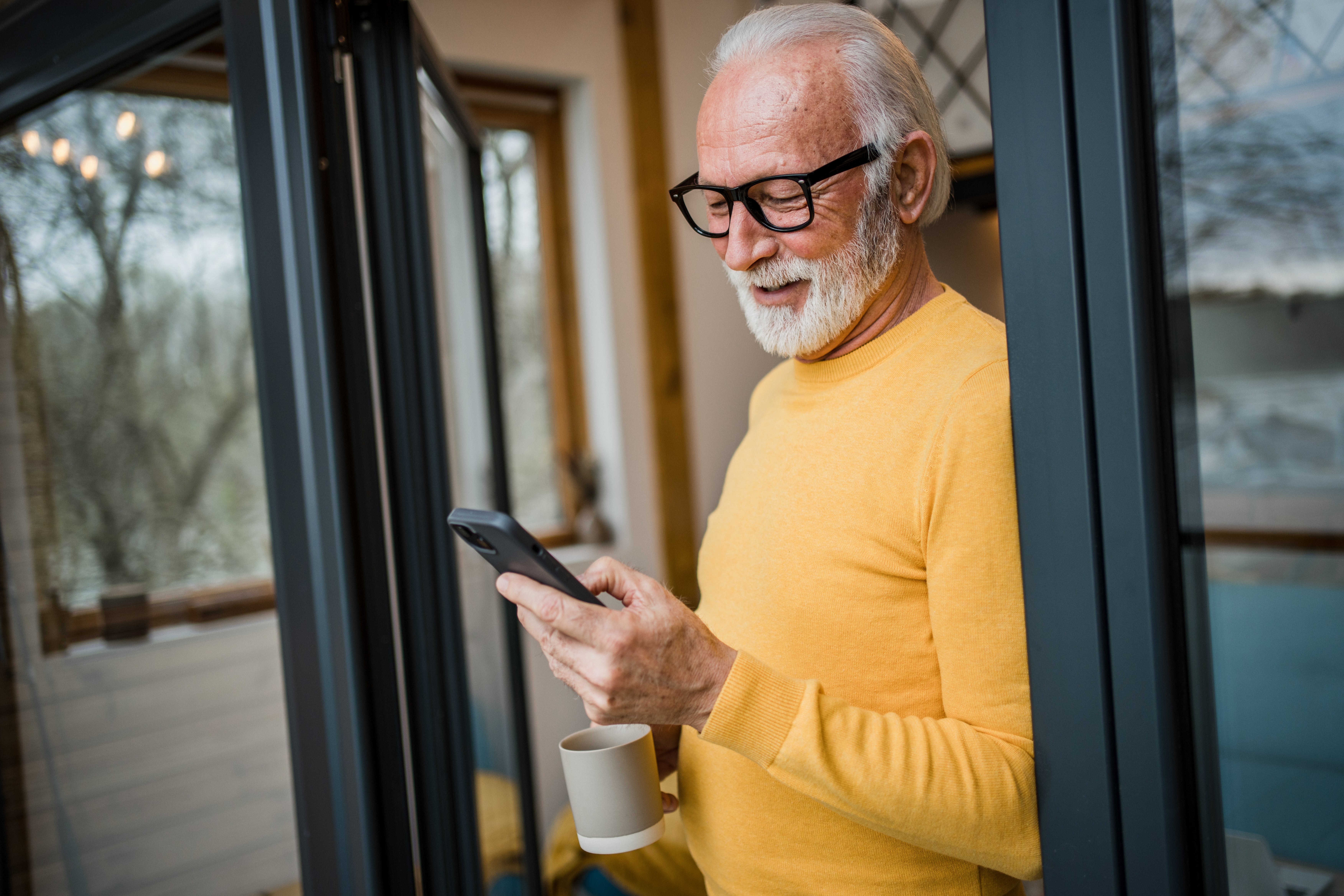 Older gentleman looking at his smartphone