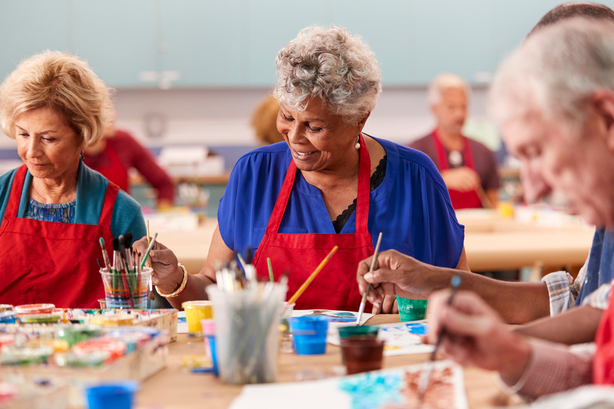 A group of older adults painting together