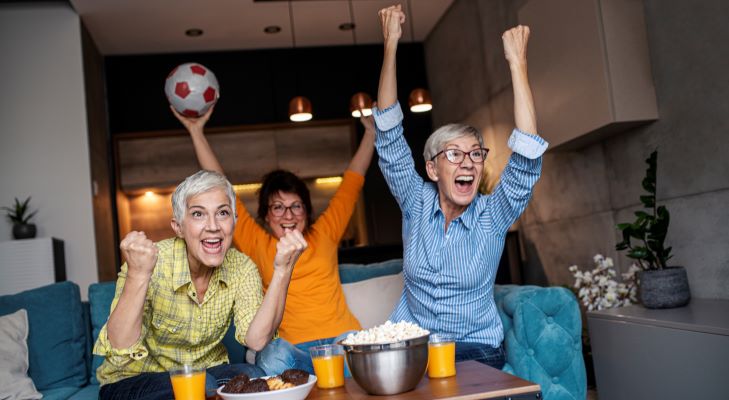 Group of older adults watching sports