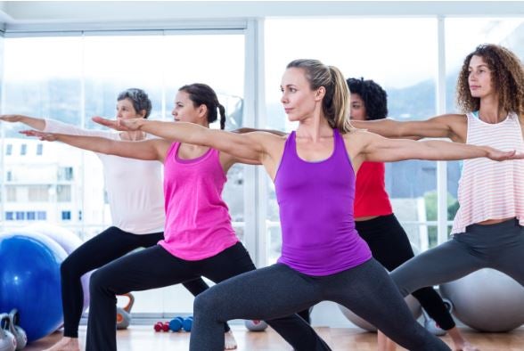 women exercising with arms outstretched 